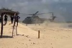 Helicóptero da FAB faz pouso de emergência no meio da praia (veja o vídeo)