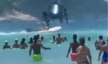 Fuzil cai de helicóptero e assusta banhistas em praia (veja o vídeo)