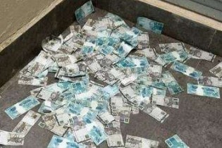 Bandidagem enlouquece: Investigado vê a PF e joga mala de dinheiro pela janela