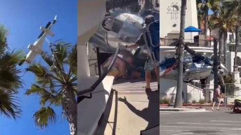 Helicóptero com cinco pessoas cai em praia famosa (veja o vídeo)